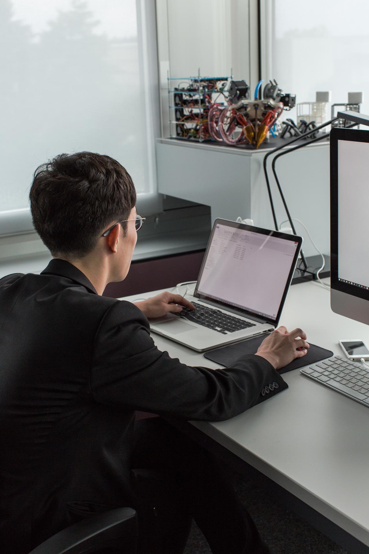 man infront of computer