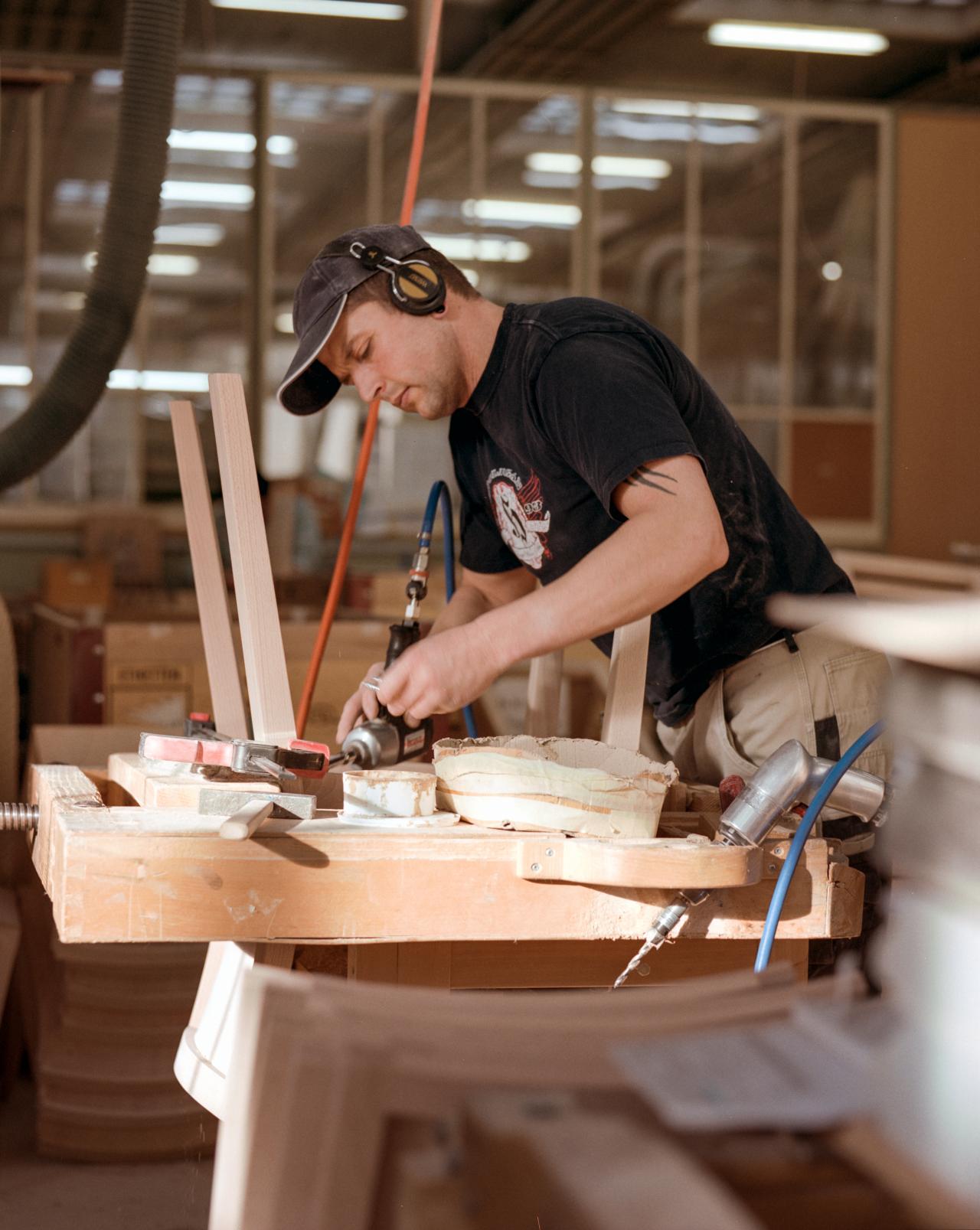 man adding chairlegs