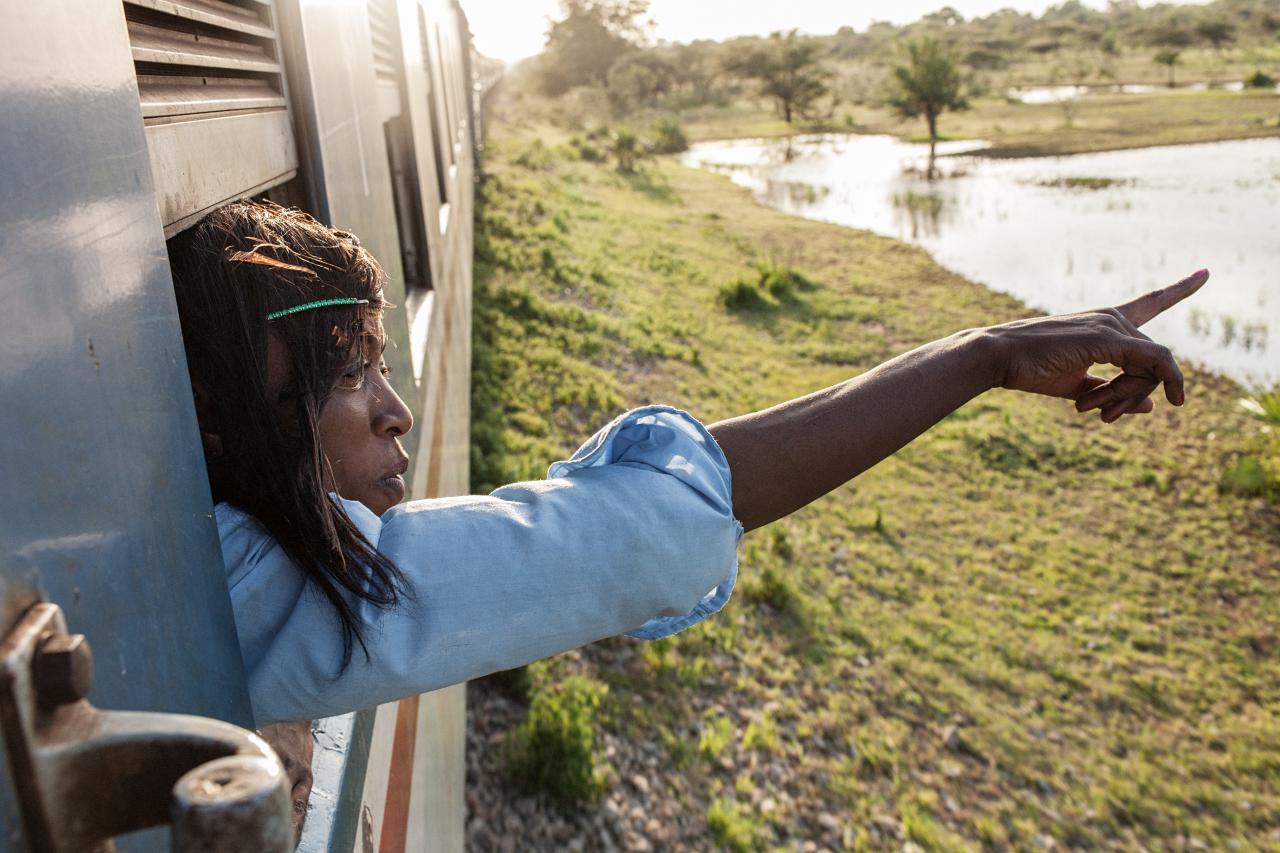 woman pointing out the window