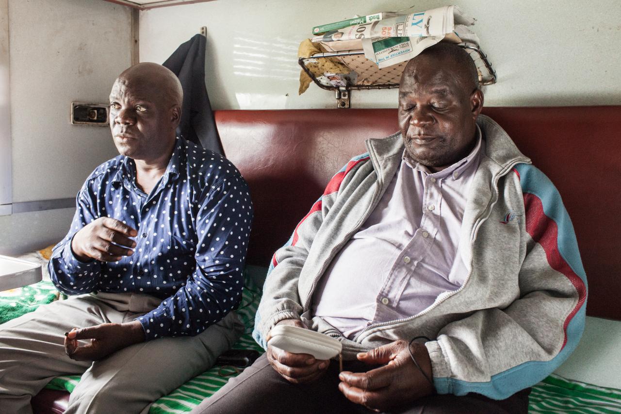 two men in train